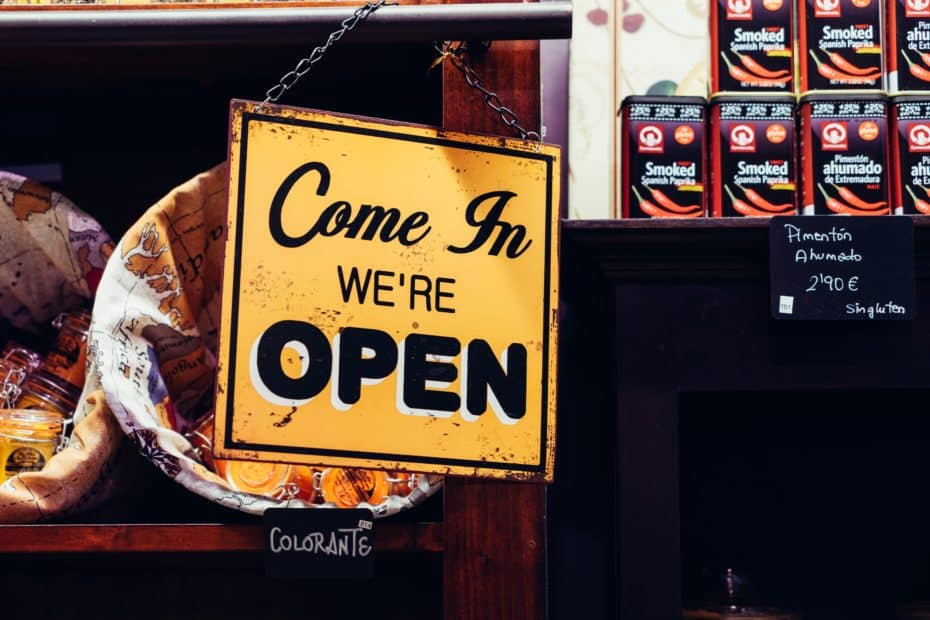 "Come in we're open sign", hanging on front door. Entrepreneurship, online business, scale, business growth